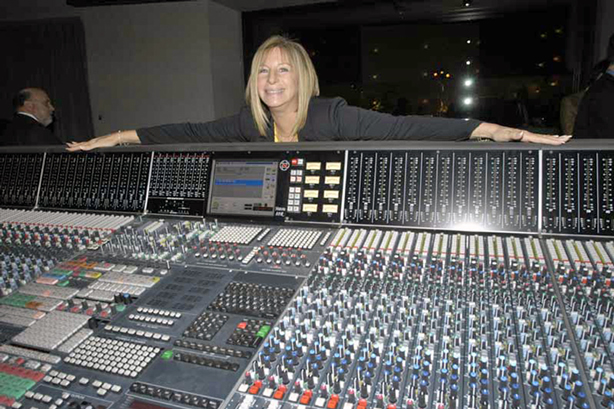 Streisand poses near recording console