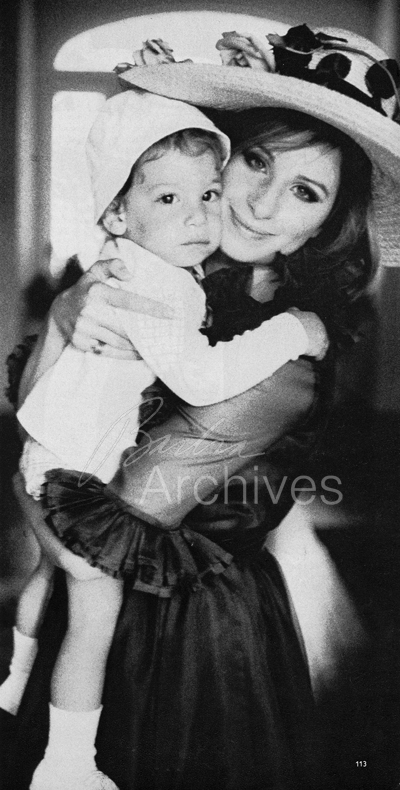 Streisand holding baby Jason Gould