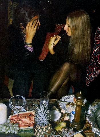 Valentino and Streisand discuss topics while seated