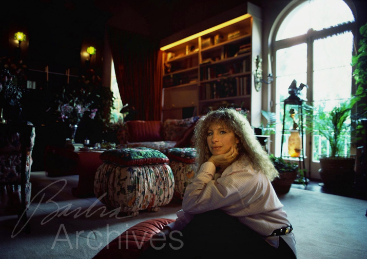 Streisand sitting in Malibu living room