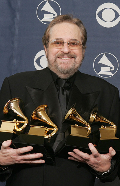 Phil Ramone holding Grammy Awards